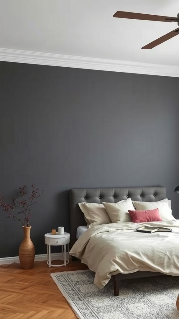 A cozy bedroom featuring a dark grey accent wall, light bedding, and stylish decor.